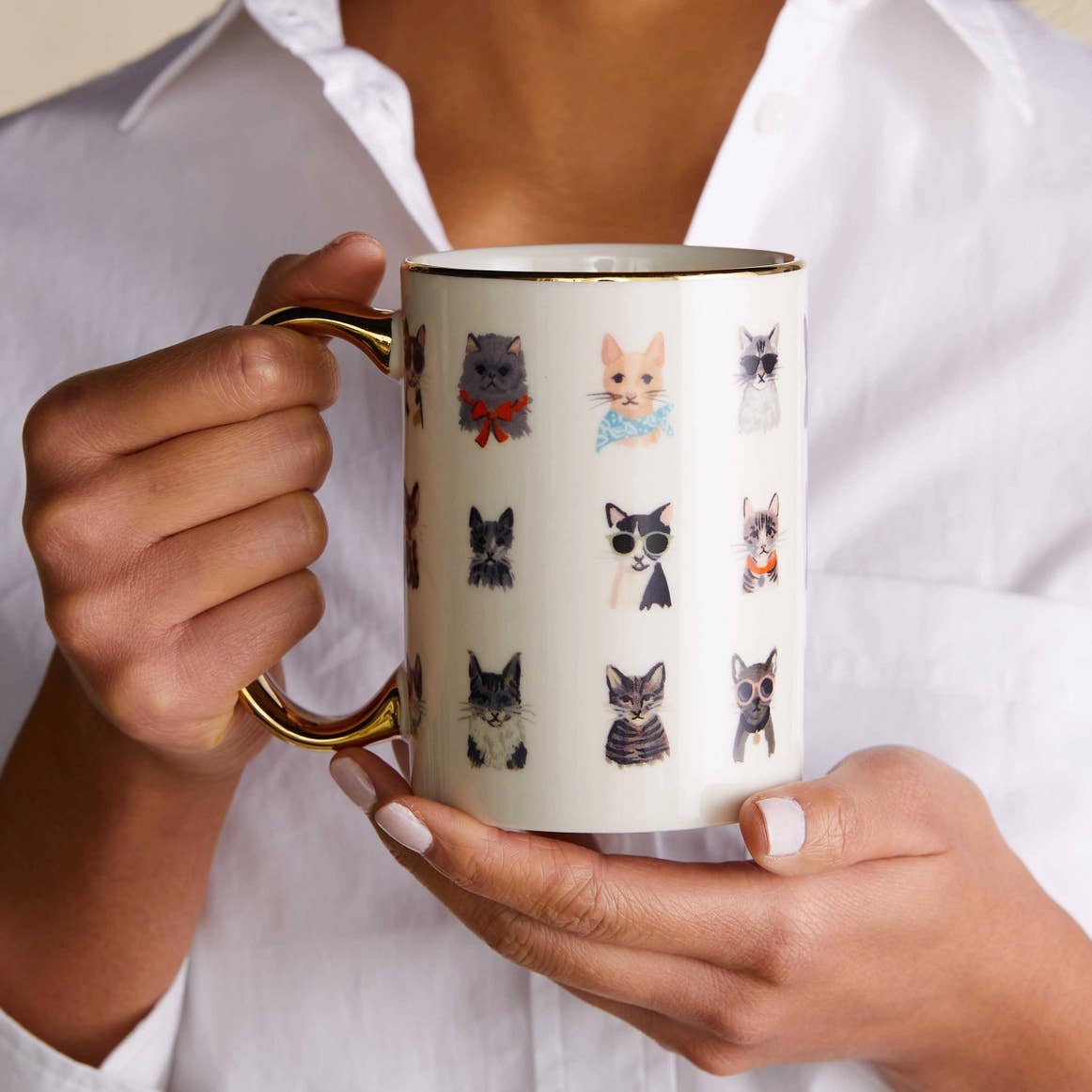 Person wearing a white button down shirt holding the Cats Porcelain Mug