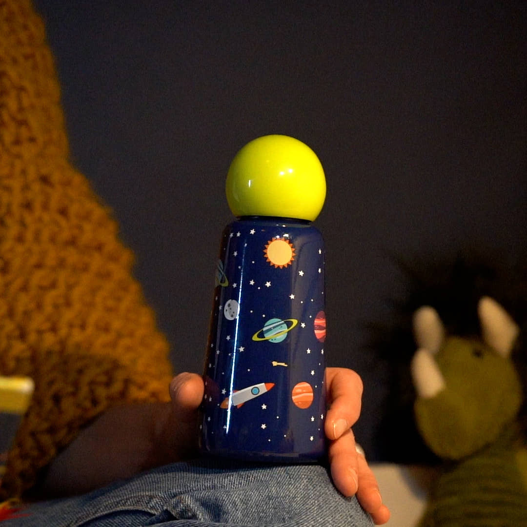 Person holding a Space Skittle Stainless Steel Bottle