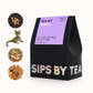 Sips by Magic Tea Kit, a black tea box with an iridescent "Sips by" print and purple topper that says "Tea Kit Magic, Loose Leaf, MIX-CAF, and Top-Rated. Discover four glitter + color-changing teas.Made by tea experts, chosen by tea lovers. We know all the tea. Love Sips by. Makes 16 Cups. Four 10G Packets (40G) (1.4OZ)"
