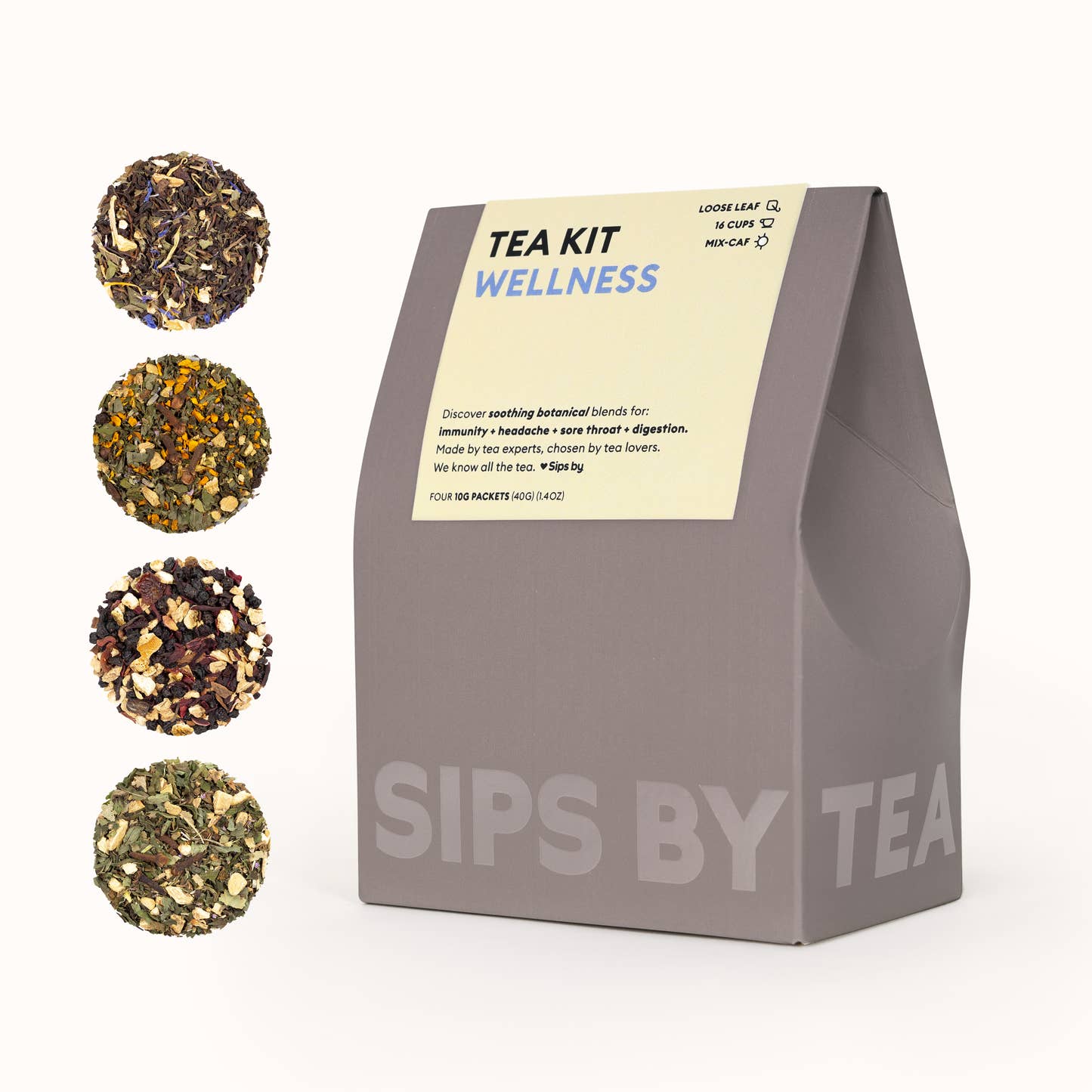 Gray box with a light green topper and blue print that says "Wellness Tea Kit - Made by tea experts, chosen by tea lovers. We know all the tea. Love Sips by. Makes 16 Cups. Four 10G Packets (40G) (1.4OZ)"