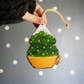 Hand holding Handmade Christmas Tree in Yellow Teacup Wooden Ornament by HandyHappy