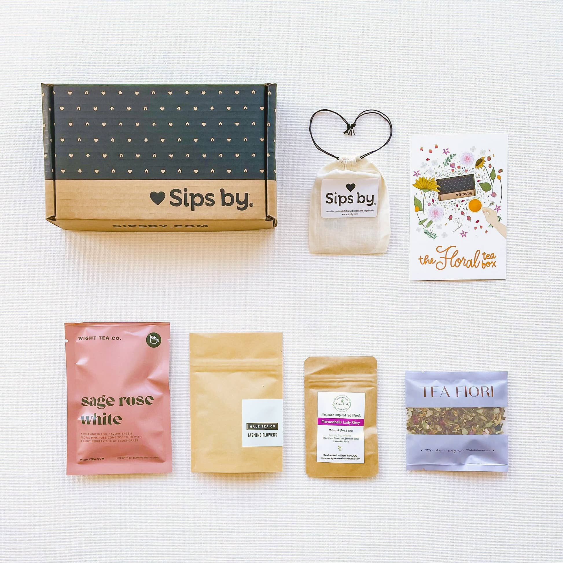 Sips by Box with four floral tea samples from Wight Tea Co, Tea Fiori, Hale Tea Co, and Rocky Mountain SereniTEA with disposable Sips by tea filters and illustrated floral tea box postcard
