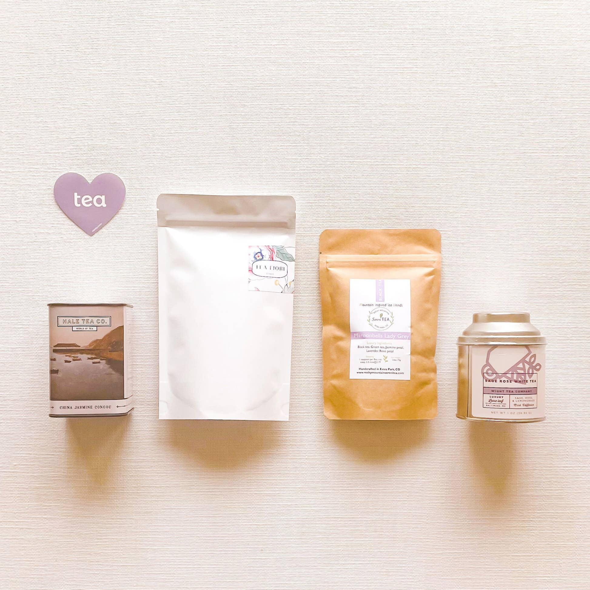Floral Tea Collection of four full-sized floral loose leaf teas and purple heart tea sticker