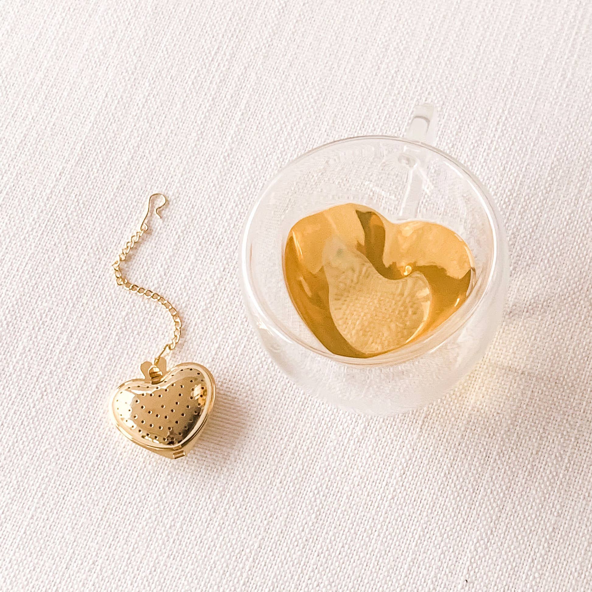 Sips by double-walled glass heart mug with tea and gold heart infuser
