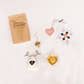 I Love You More Tea Kit with a loose leaf tea pouch by Cookie Tea, a gold heart infuser, physical Sips by Box gift card, and glass heart mug with brewed tea