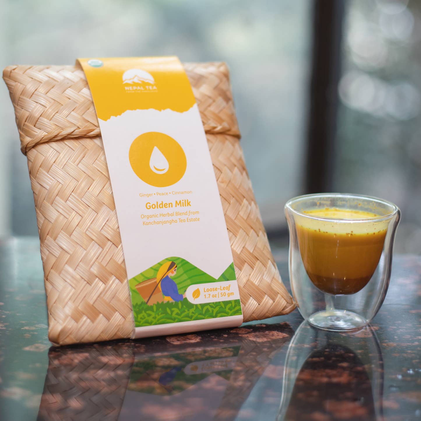Organic Golden Milk tea package and brewed cup by Nepal Tea