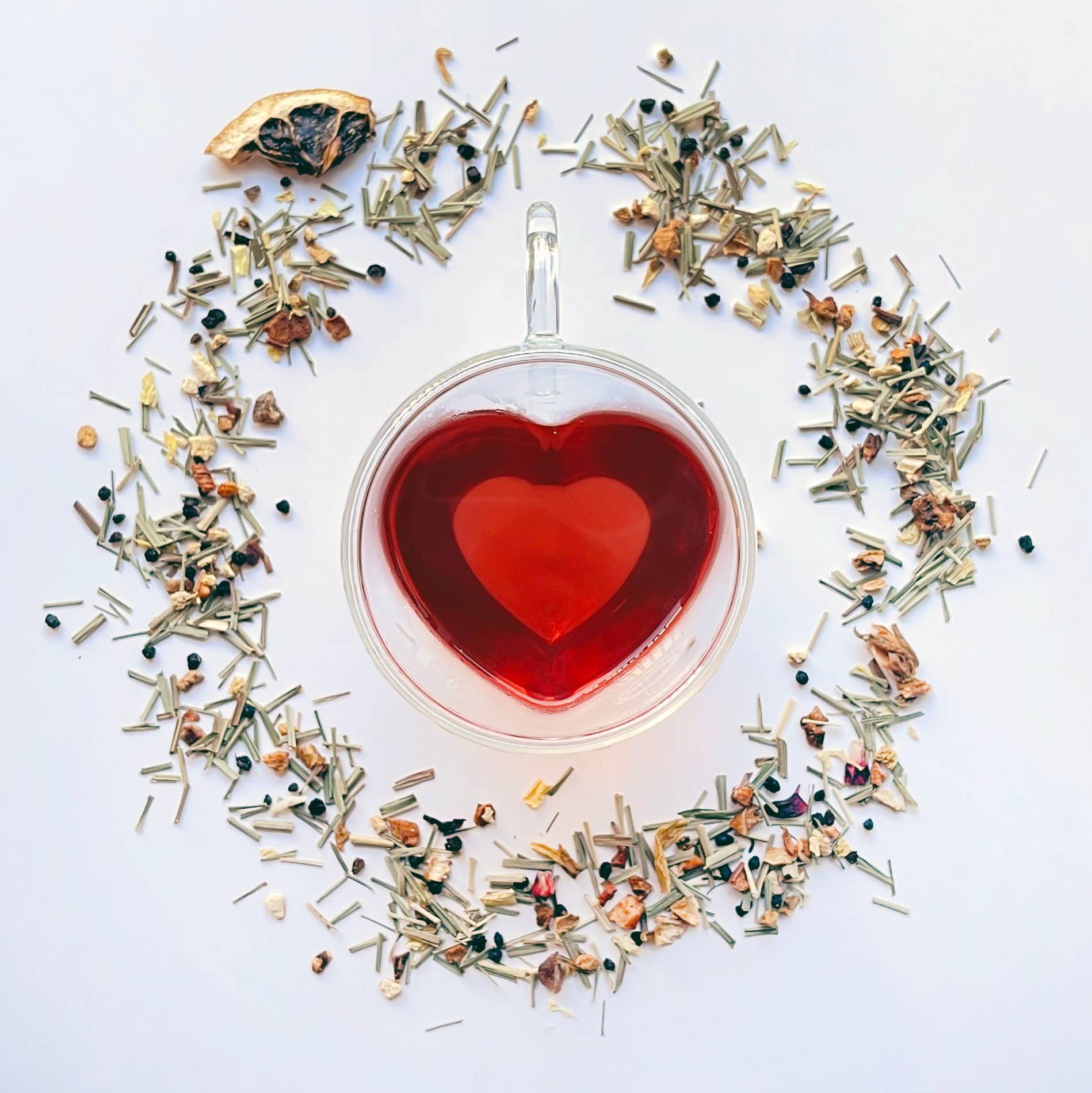 Glass heart mug with joyful tea by your botanical friend and loose tea