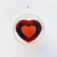 Glass heart mug with steeped Joyful tea by Your Botanical Friend