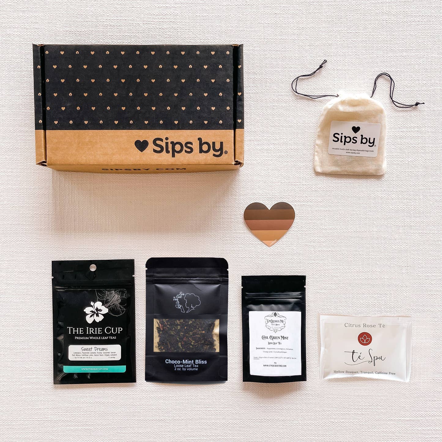 Four samples of tea from black-owned tea brands with a Sips by box and tea heart sticker