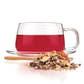 Brewed Immunity Berry Rooibos by Tealyra in a clear mug with loose leaf tea sample