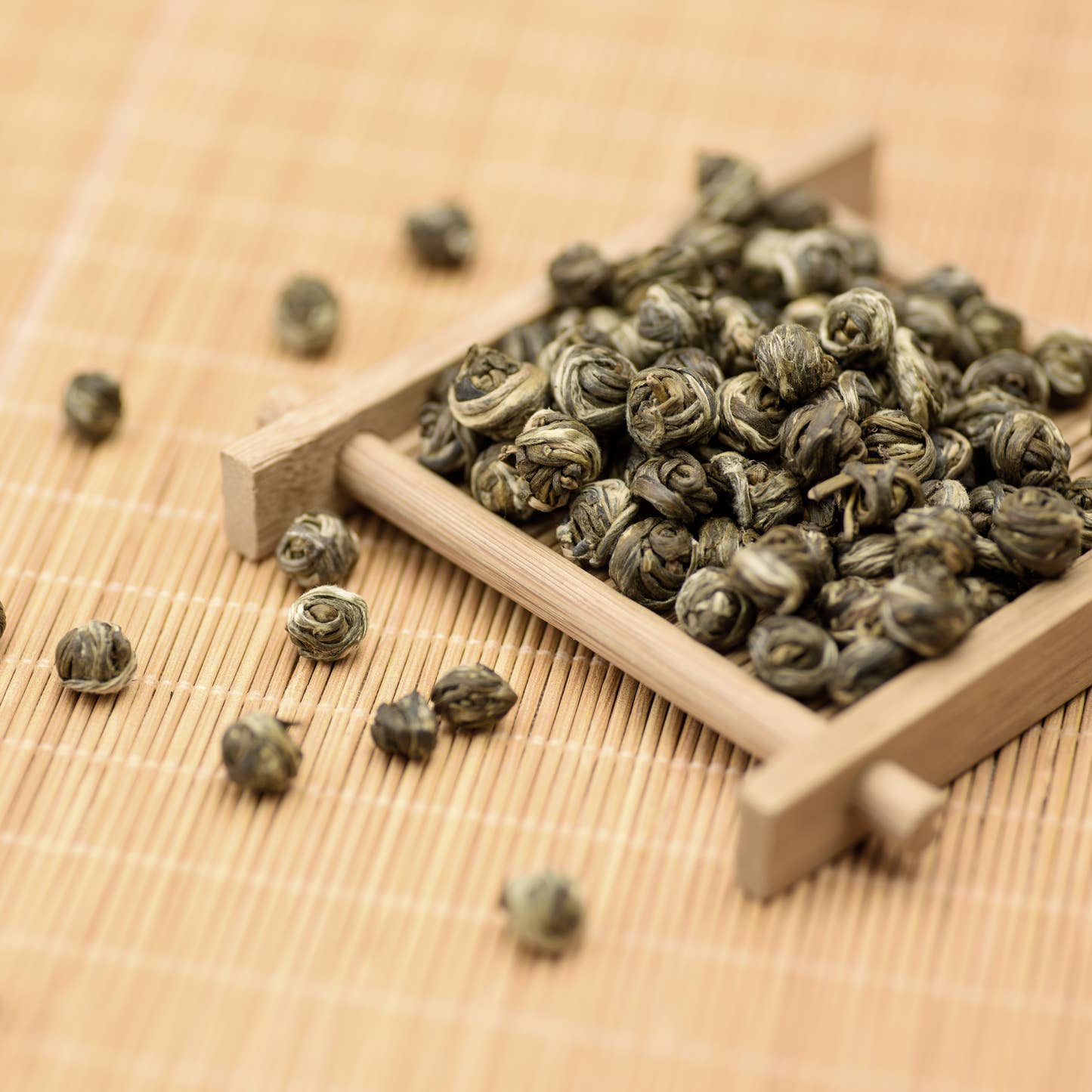 Jasmine Dragon Pearls Long Zhu Green Tea on bamboo