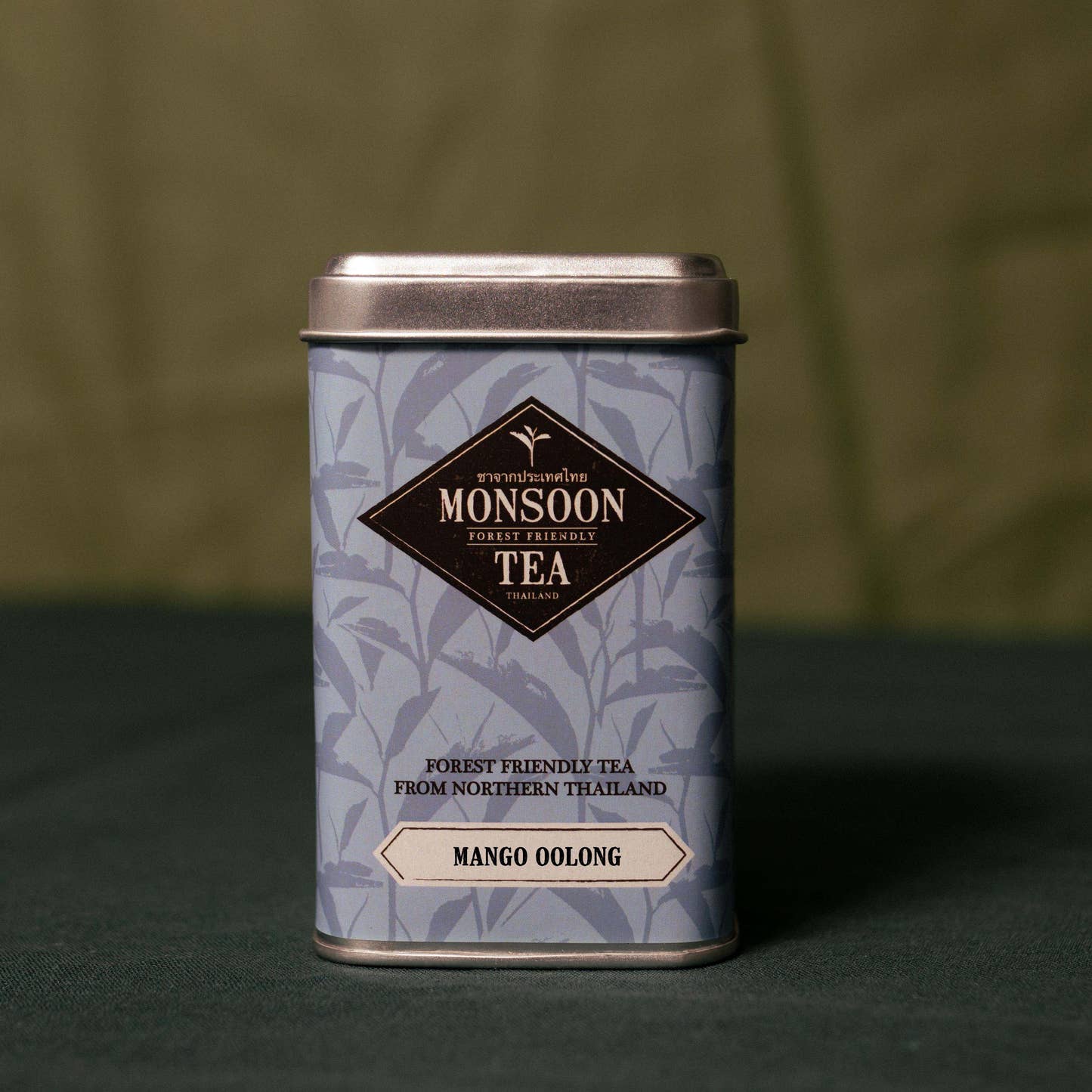 Mango Oolong by Monsoon Tea loose leaf tea tin printed with blue tea leaves