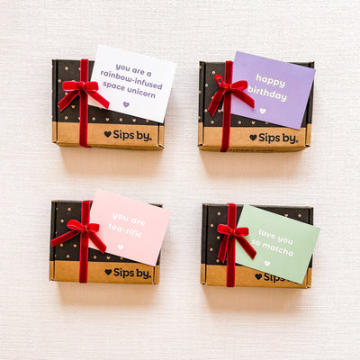 4 mini Sips by boxes with gift card notes and red velvet bows