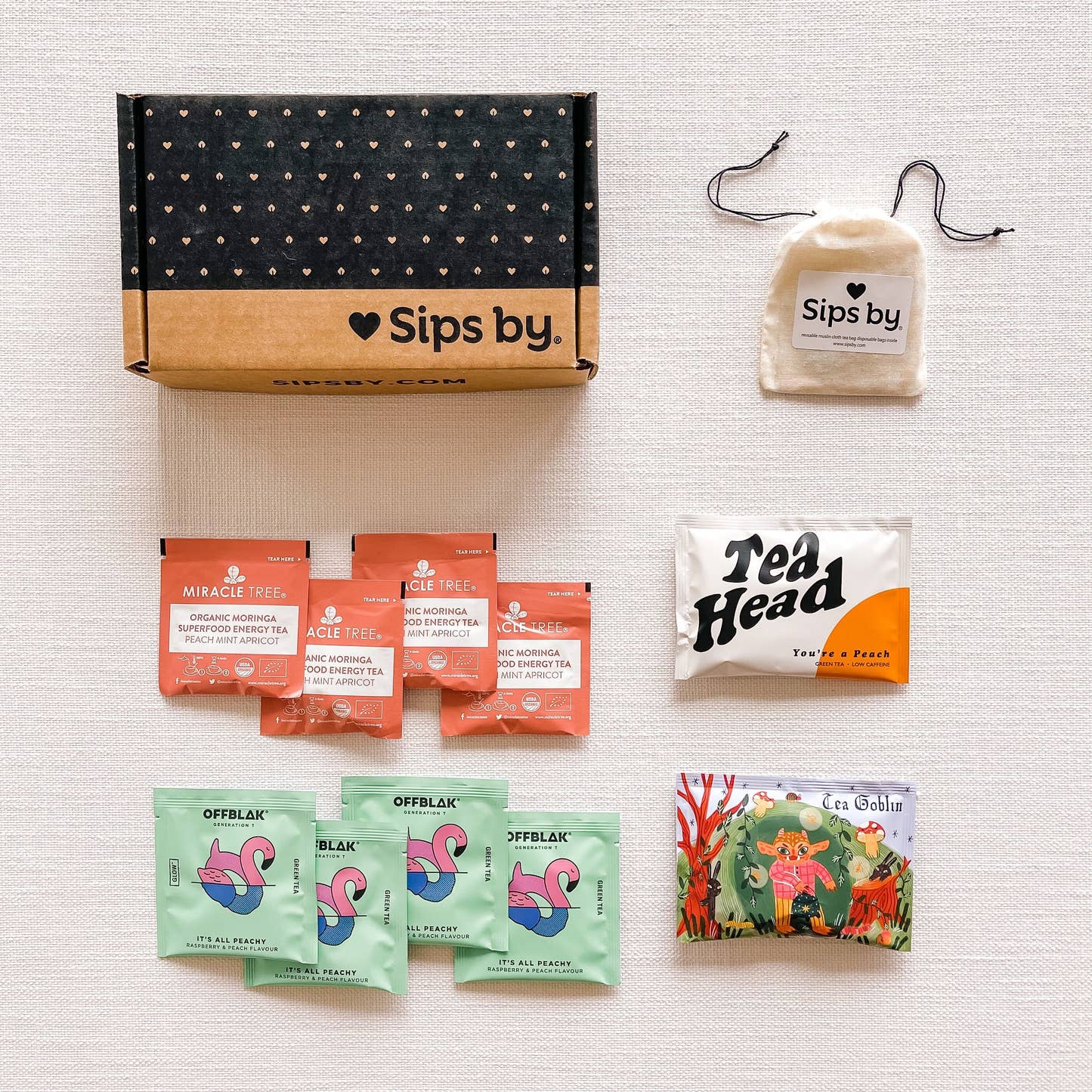 Sips by Box with peach tea samples from Tea Head, Miracle Tree, OFFBLAK, and Tea Goblin