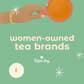 Green women-owned tea brands illustration with a hand holding a cup of tea and the Sips by tea heart logo
